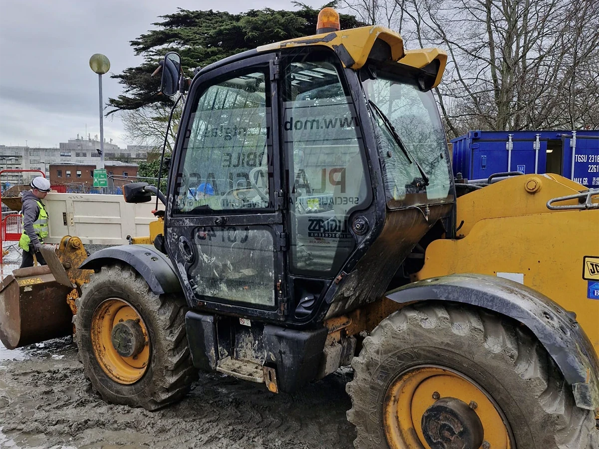 JCB telehandler cab glass fitted on a construction site