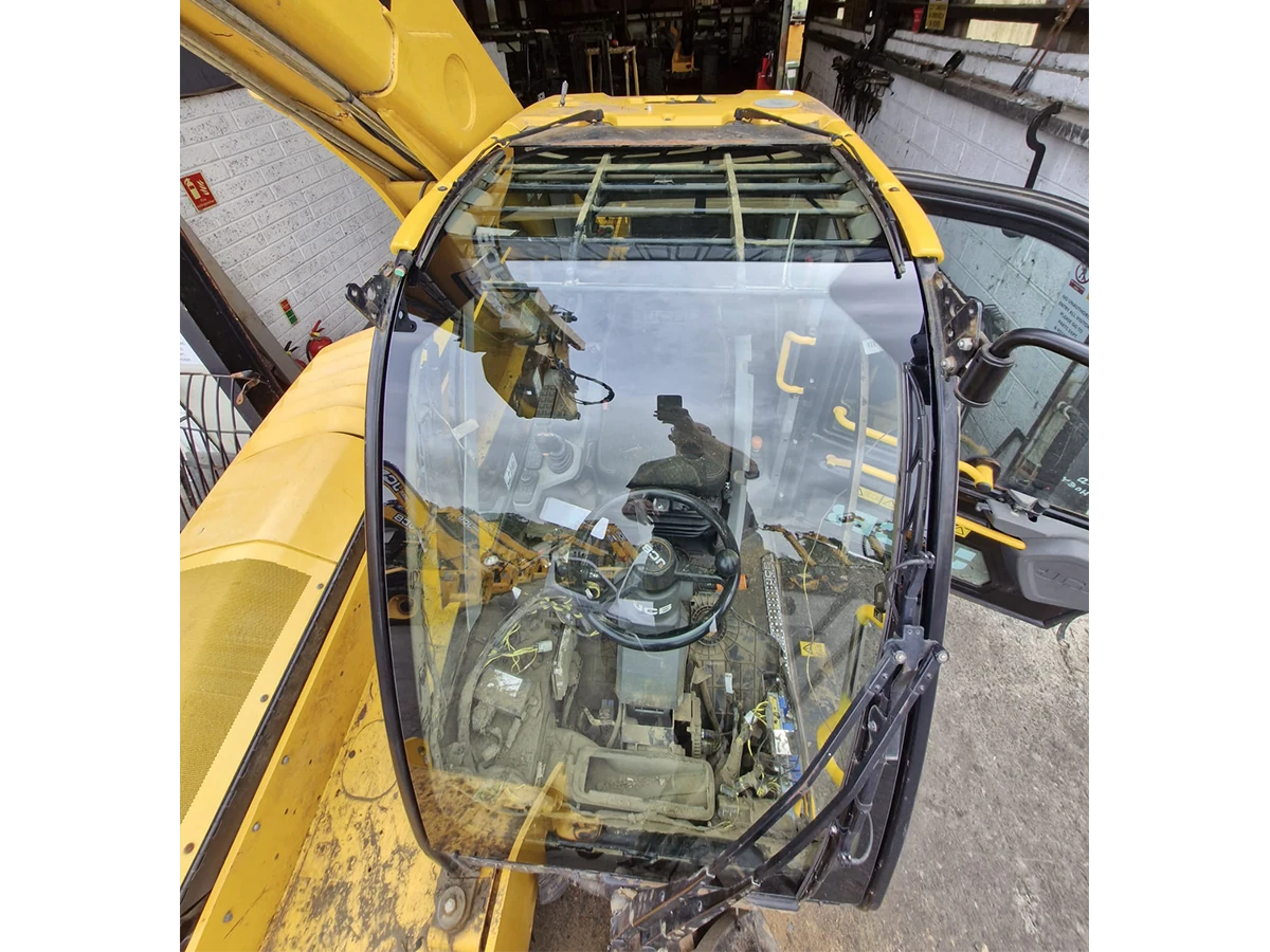 JCB plant machine with a replacement cab glass