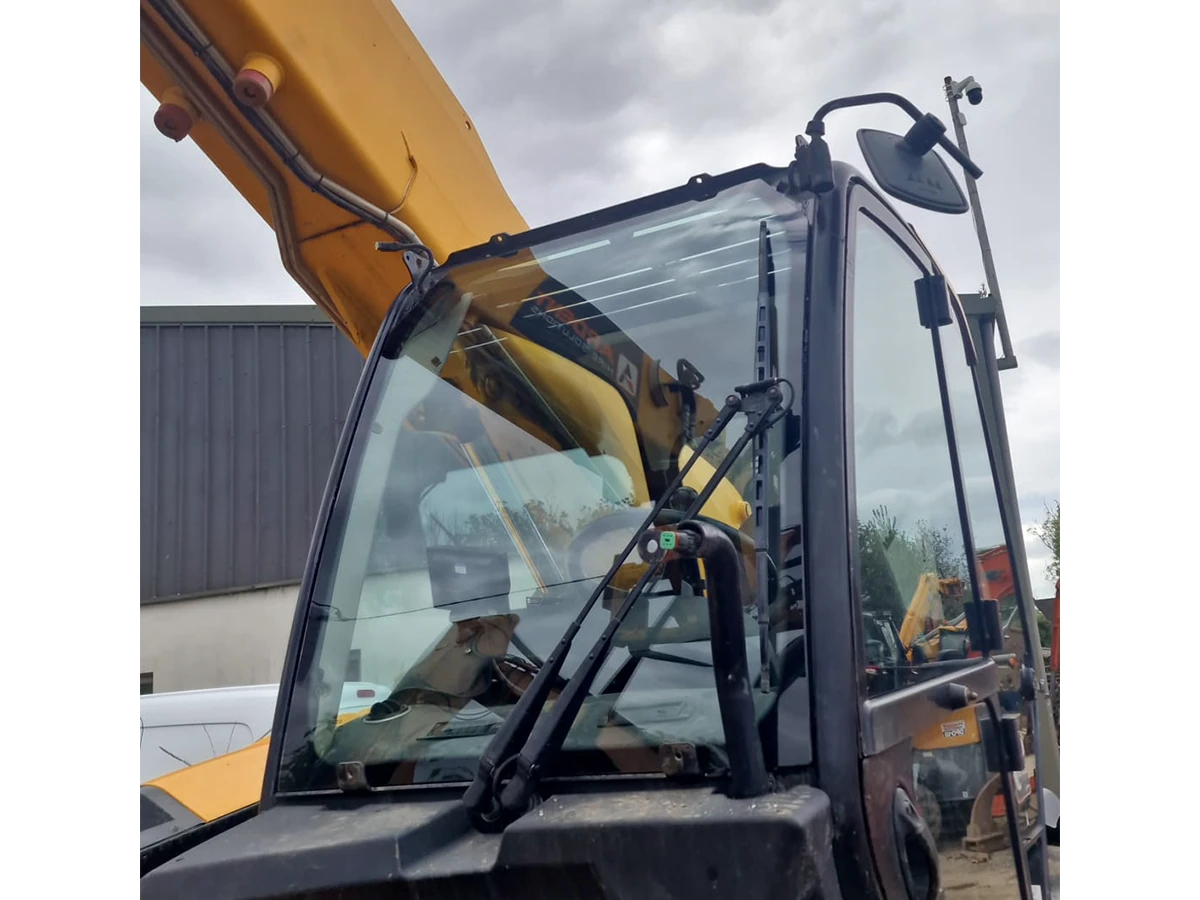 JCB plant machine with replacement cab glass
