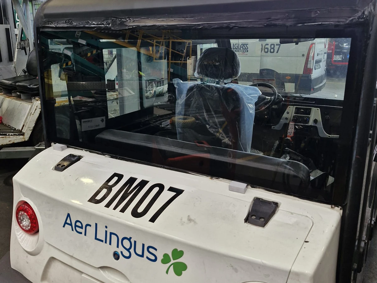 Aer Lingus airport baggage tug with replacement cab glass in the workshop