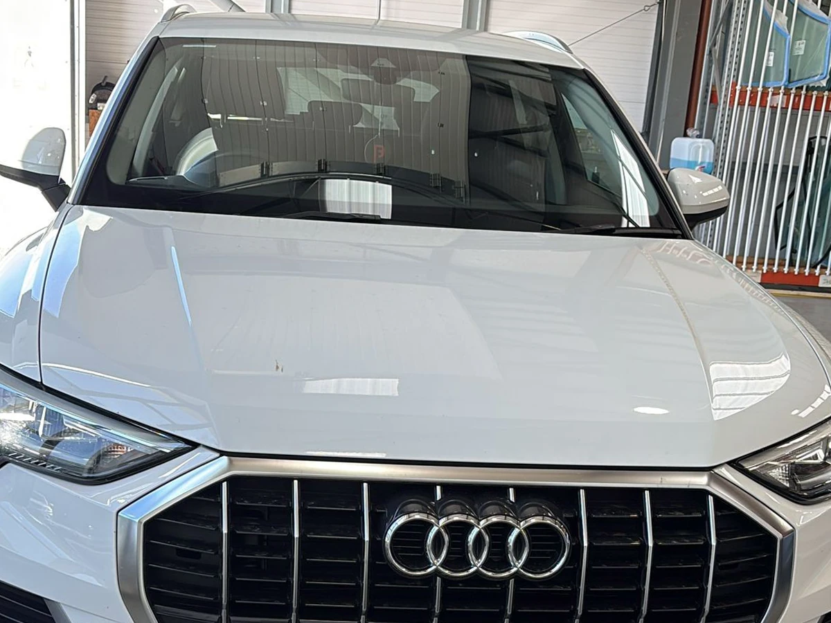 White Audi with a newly fitted front windscreen