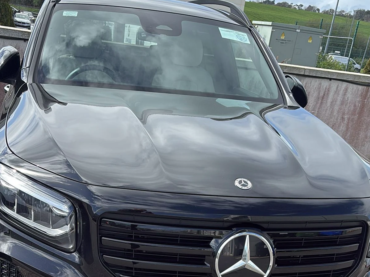 Black Mercedes-Benz with a newly fitted windscreen