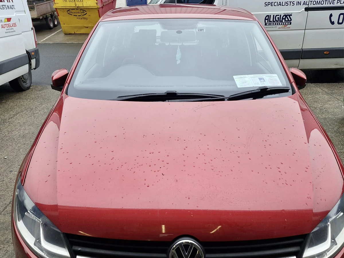 Red Volkswagen with a newly fitted windscreen